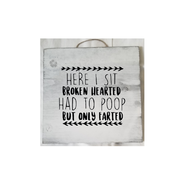 Whitewashed wooden sign