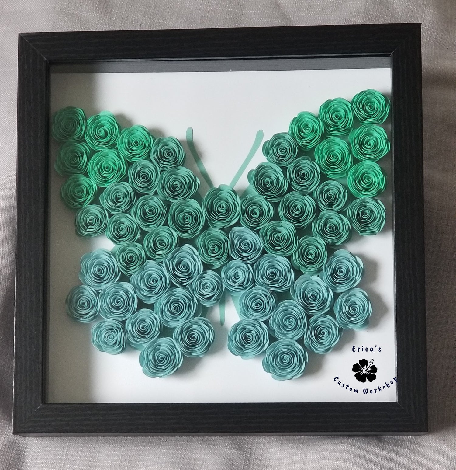 Rolled paper flowers in the shape of a butterfly